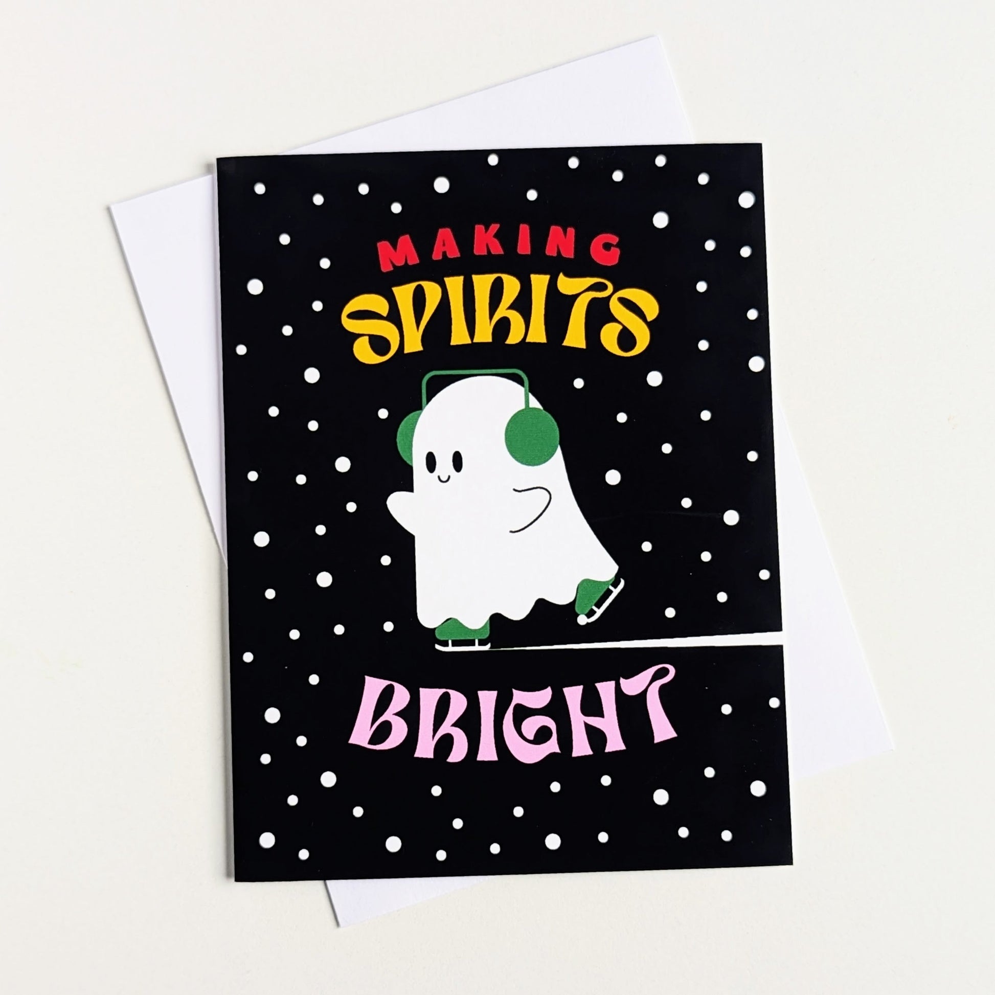 Greeting card with a ghost illustration and text 'Making Spirits Bright' on a black background with white polka dots.