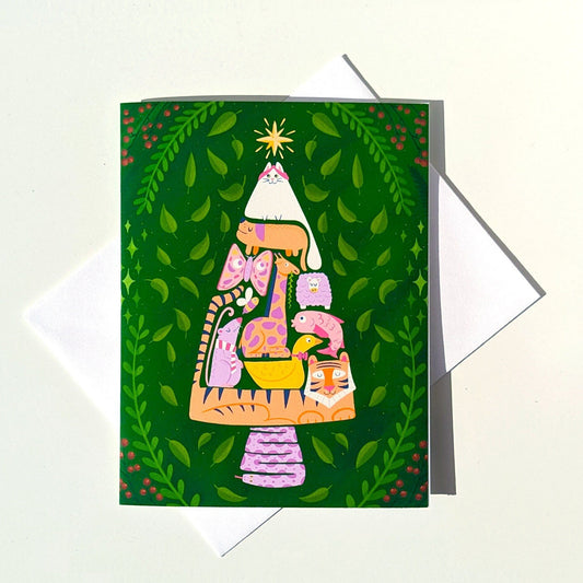 Greeting card with colorful illustration of a cat in a hat on a green background
