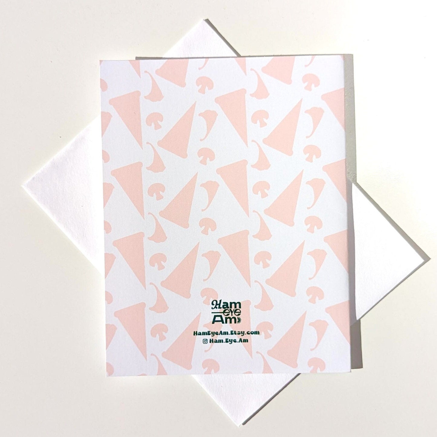 Notebook with pink geometric pattern on a light gray background