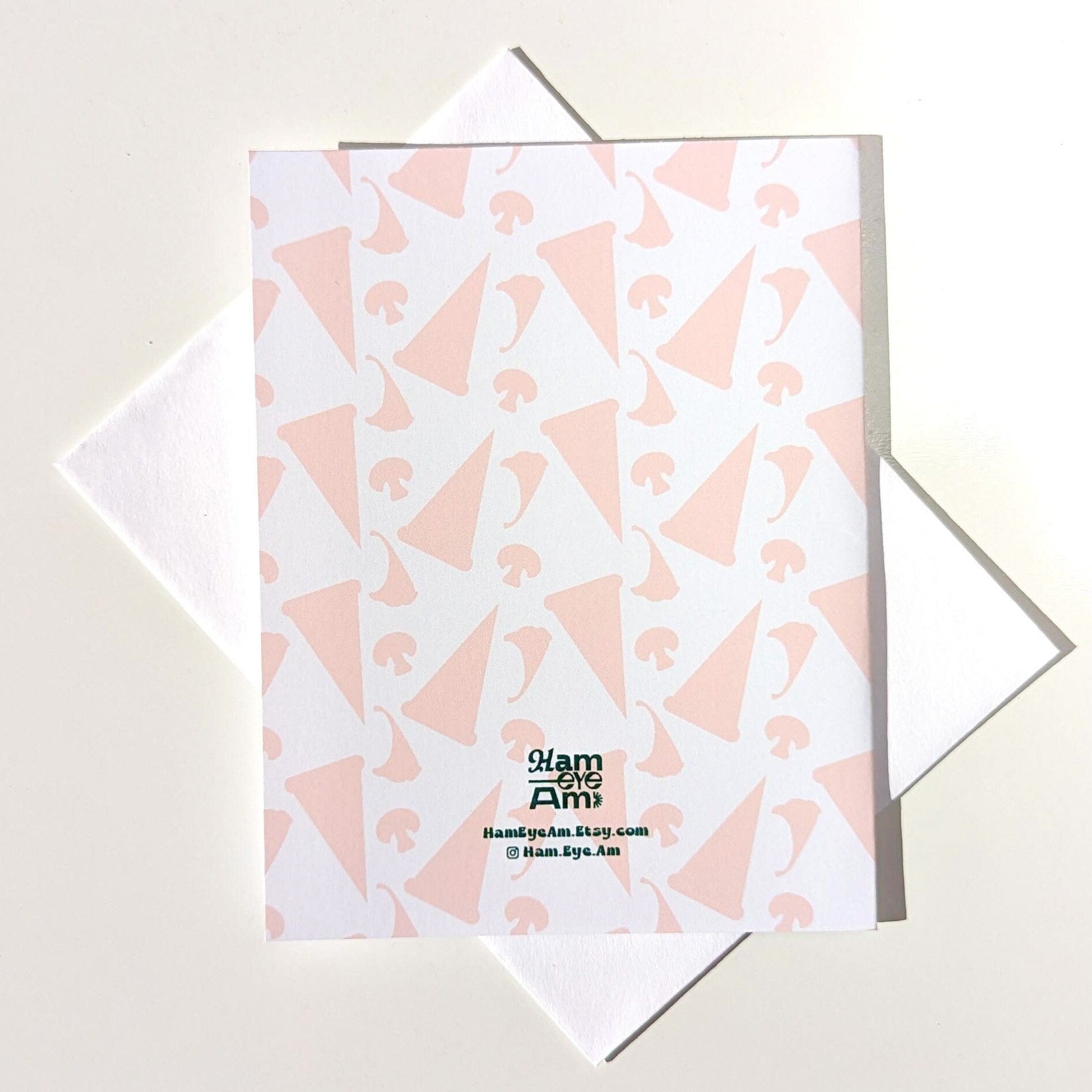 Notebook with pink geometric pattern on a light gray background
